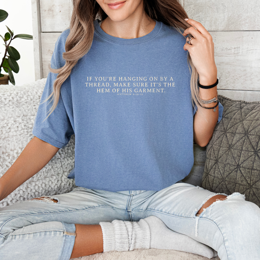 Hanging on By The Hem of His Garment Christian Graphic Tee