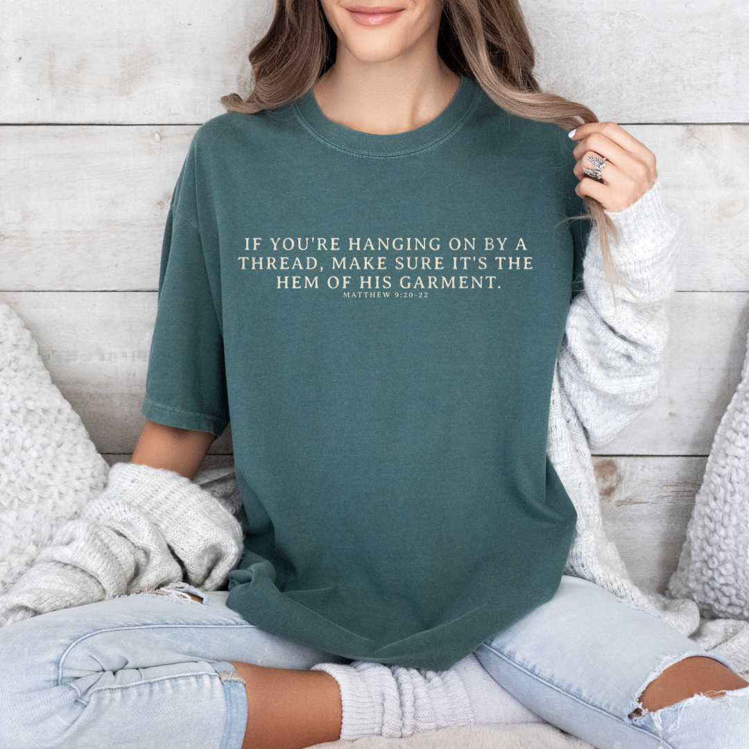 Hanging on By The Hem of His Garment Christian Graphic Tee