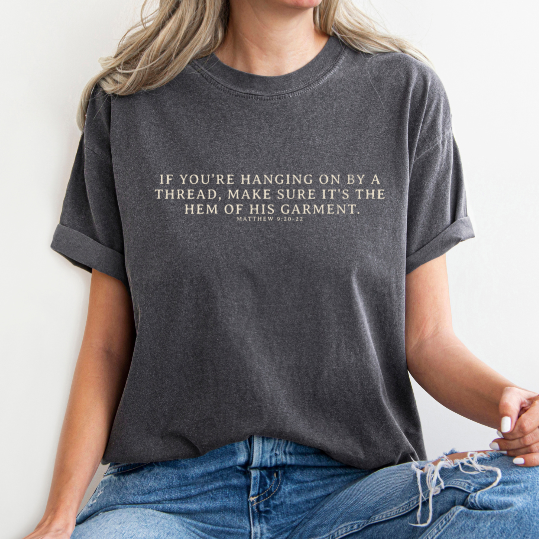 Hanging on By The Hem of His Garment Christian Graphic Tee