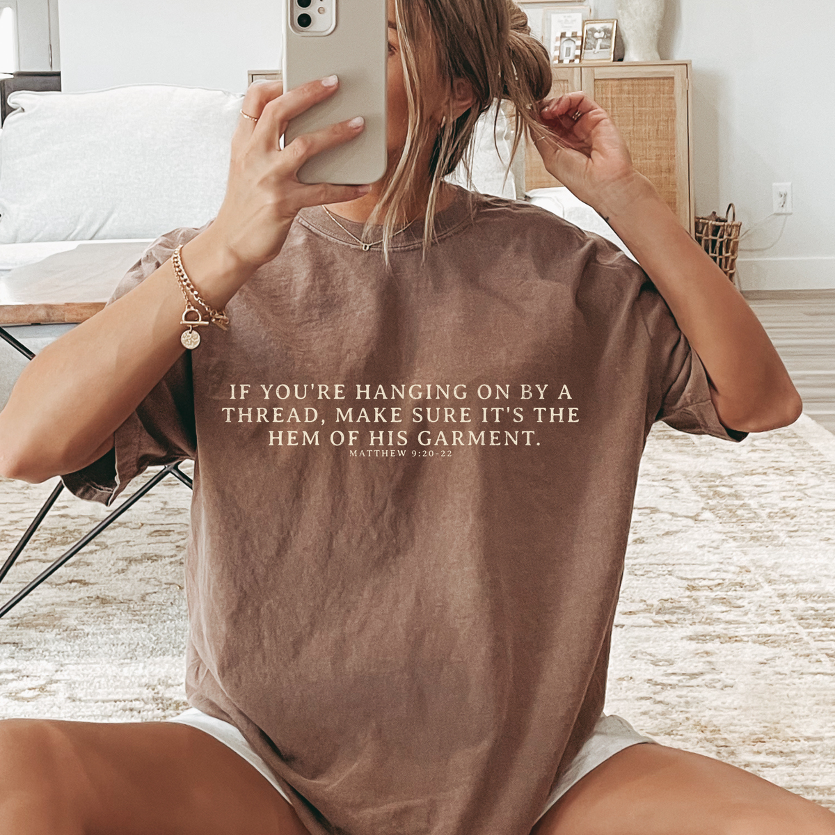 Hanging on By The Hem of His Garment Christian Graphic Tee