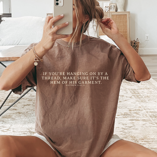 Hanging on By The Hem of His Garment Christian Graphic Tee